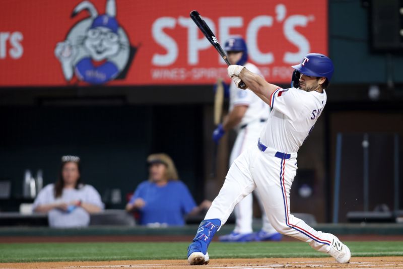 May 14, 2025; Arlington, Texas, USA; Texas Rangers shortstop Josh Smith (8) hits a single during the first inning against the Colorado Rockies at Globe Life Field. Mandatory Credit: Tim Heitman-Imagn Images