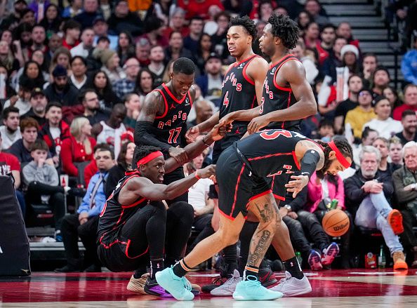 TORONTO, ON - DECEMBER 23: Pascal Siakam #43 of the Toronto Raptors is picked up by Dennis Schroder #17, Scottie Barnes #4, OG Anunoby #3 and Gary Trent Jr. #33 against the Utah Jazz during the second half of their basketball game at the Scotiabank Arena on December 23, 2023 in Toronto, Ontario, Canada. NOTE TO USER: User expressly acknowledges and agrees that, by downloading and/or using this Photograph, user is consenting to the terms and conditions of the Getty Images License Agreement. (Photo by Mark Blinch/Getty Images)