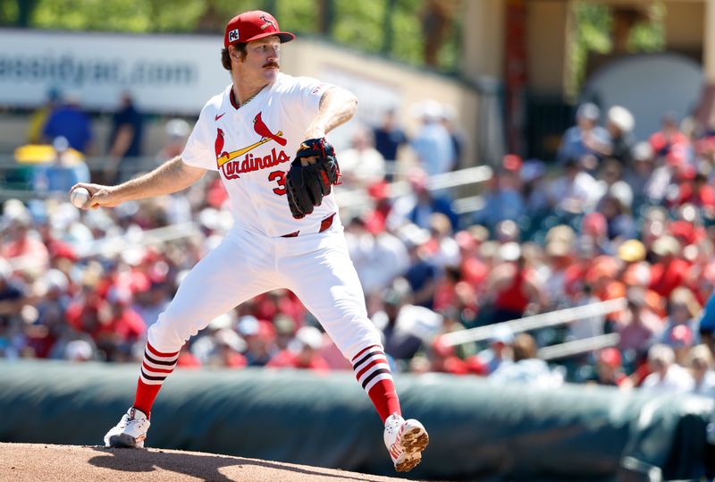 Mar 18, 2025; Jupiter, Florida, USA;  St. Louis Cardinals starting pitcher Miles Mikolas (39) pitches against the Miami Marlins during the first inning at Roger Dean Chevrolet Stadium. Mandatory Credit: Rhona Wise-Imagn Images