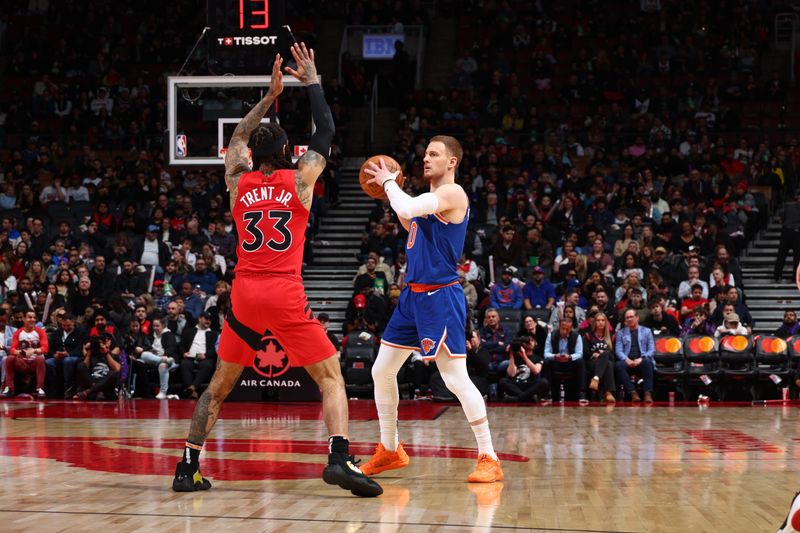 TORONTO, CANADA - MARCH 27: Donte Divincenzo #0 of the New York Knicks handles the ball during the game against the Toronto Raptors on March 27, 2024 at the Scotiabank Arena in Toronto, Ontario, Canada.  NOTE TO USER: User expressly acknowledges and agrees that, by downloading and or using this Photograph, user is consenting to the terms and conditions of the Getty Images License Agreement.  Mandatory Copyright Notice: Copyright 2024 NBAE (Photo by Vaughn Ridley/NBAE via Getty Images)