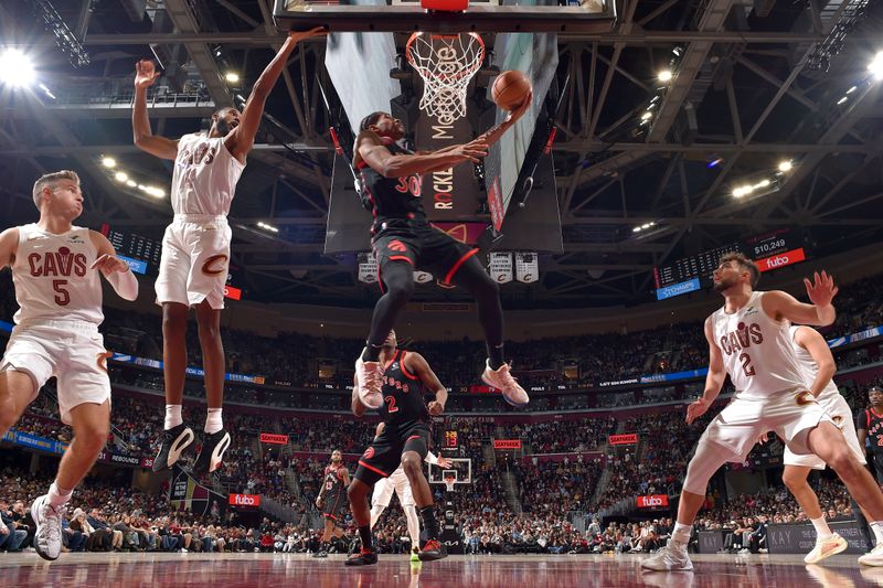 CLEVELAND, OH - NOVEMBER 24: Ochai Agbaji #30 of the Toronto Raptors drives to the basket during the game against the Cleveland Cavaliers on November 24, 2024 at Rocket Mortgage FieldHouse in Cleveland, Ohio. NOTE TO USER: User expressly acknowledges and agrees that, by downloading and/or using this Photograph, user is consenting to the terms and conditions of the Getty Images License Agreement. Mandatory Copyright Notice: Copyright 2024 NBAE (Photo by David Liam Kyle/NBAE via Getty Images)