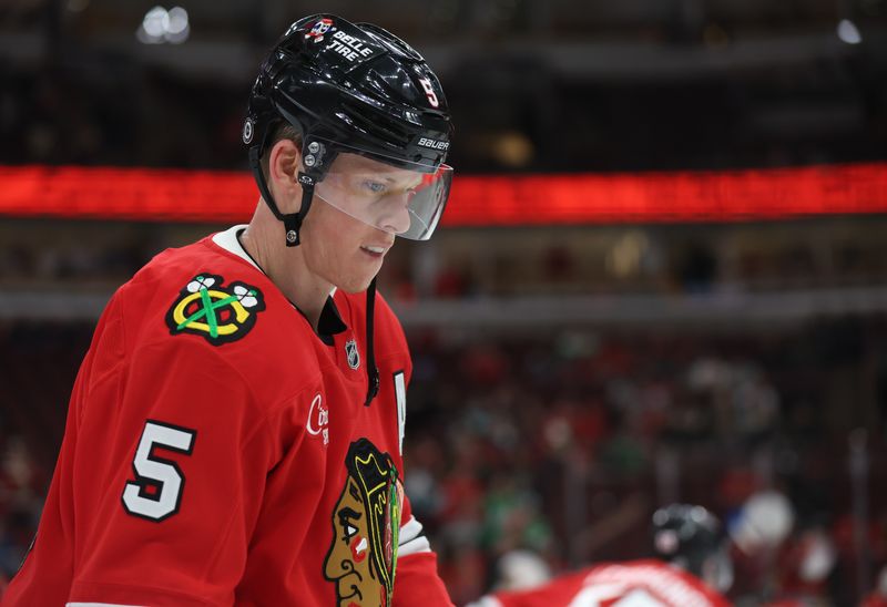 Mar 18, 2025; Chicago, Illinois, USA; Chicago Blackhawks defenseman Connor Murphy (5) warms up before a game against the Seattle Kraken at United Center. Mandatory Credit: Talia Sprague-Imagn Images