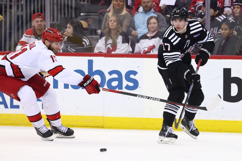 Mar 9, 2024; Newark, New Jersey, USA; New Jersey Devils defenseman Simon Nemec (17) passes the puck against the New Jersey Devils during the third period at Prudential Center. Mandatory Credit: Ed Mulholland-USA TODAY Sports