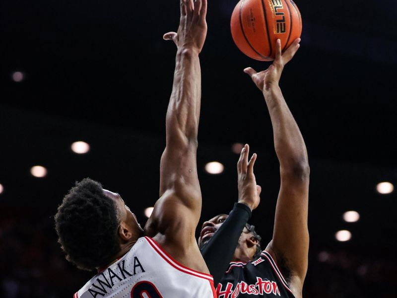 Feb 15, 2025; Tucson, Arizona, USA; Arizona Wildcats forward Tobe Awaka (30) attempts to block a shot attempted by Houston Cougars forward J’Wan Roberts (13) during the first half at McKale Center. Mandatory Credit: Aryanna Frank-Imagn Images