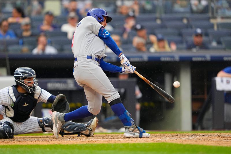 Jul 8, 2023; Bronx, New York, USA; Chicago Cubs designated hitter Mike Tauchman (40) hits a two run home run against the New York Yankees during the eighth inning at Yankee Stadium. Mandatory Credit: Gregory Fisher-USA TODAY Sports