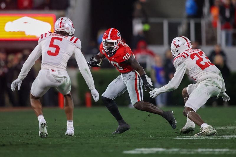 Nov 11, 2023; Athens, Georgia, USA; Georgia Bulldogs running back Daijun Edwards (30) runs the ball against the Mississippi Rebels in the second quarter at Sanford Stadium. Mandatory Credit: Brett Davis-USA TODAY Sports
