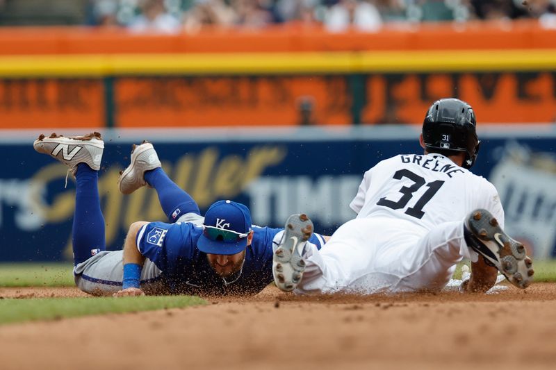 Apr 28, 2024; Detroit, Michigan, USA;  Kansas City Royals shortstop Bobby Witt Jr. (7) tags Detroit Tigers left fielder Riley Greene (31) out at second in the fifth inning at Comerica Park. Mandatory Credit: Rick Osentoski-USA TODAY Sports