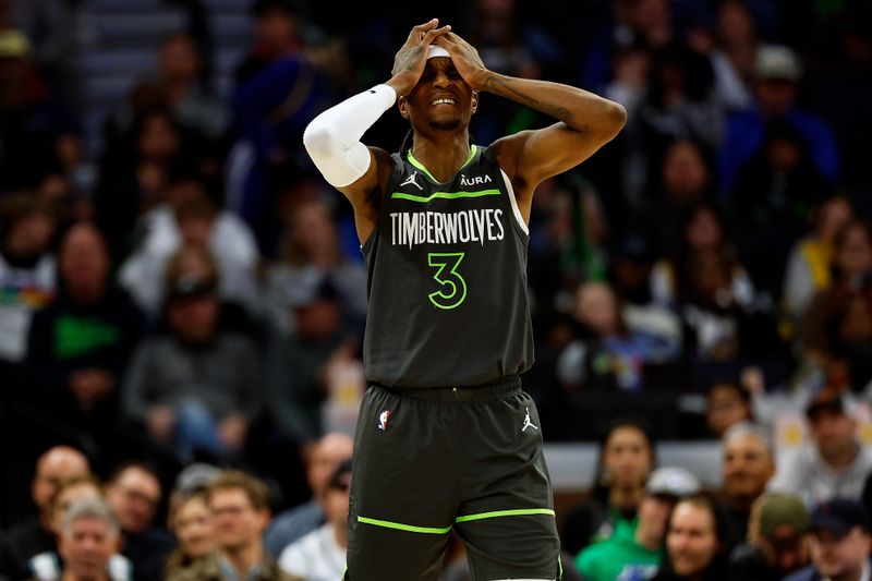 MINNEAPOLIS, MINNESOTA - MARCH 24: Jaden McDaniels #3 of the Minnesota Timberwolves reacts to his foul against the Golden State Warriors in the third quarter at Target Center on March 24, 2024 in Minneapolis, Minnesota. The Timberwolves defeated the Warriors 114-110. NOTE TO USER: User expressly acknowledges and agrees that, by downloading and or using this photograph, User is consenting to the terms and conditions of the Getty Images License Agreement. (Photo by David Berding/Getty Images)