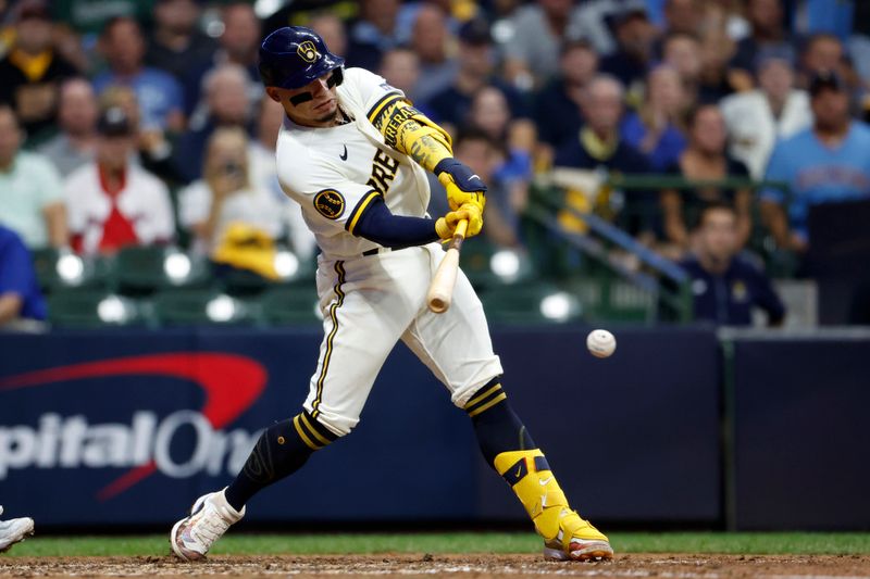 Oct 4, 2023; Milwaukee, Wisconsin, USA; Milwaukee Brewers catcher William Contreras (24) singles in the eighth inning against the Arizona Diamondbacks during game two of the Wildcard series for the 2023 MLB playoffs at American Family Field. Mandatory Credit: Kamil Krzaczynski-USA TODAY Sports