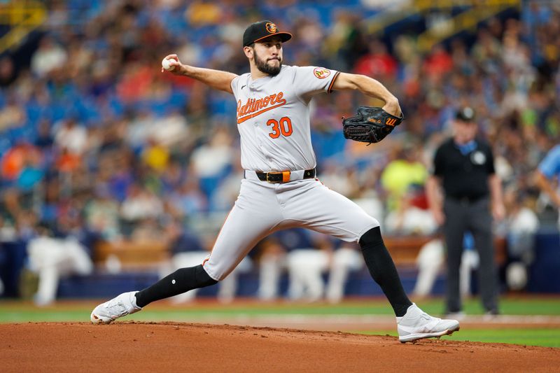 Jun 9, 2024; St. Petersburg, Florida, USA;  Baltimore Orioles pitcher Grayson Rodriguez (30) throws a pitch against the Tampa Bay Rays in the first inning at Tropicana Field. Mandatory Credit: Nathan Ray Seebeck-USA TODAY Sports