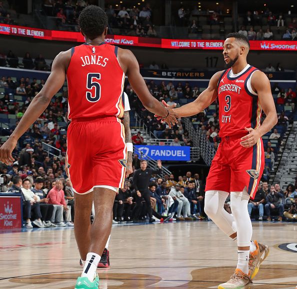 NEW ORLEANS, LA - DECEMBER 11: Herb Jones #5 and CJ McCollum #3 of the New Orleans Pelicans high five during the game against the Minnesota Timberwolves on December 11, 2023 at the Smoothie King Center in New Orleans, Louisiana. NOTE TO USER: User expressly acknowledges and agrees that, by downloading and or using this Photograph, user is consenting to the terms and conditions of the Getty Images License Agreement. Mandatory Copyright Notice: Copyright 2023 NBAE (Photo by Layne Murdoch Jr./NBAE via Getty Images)