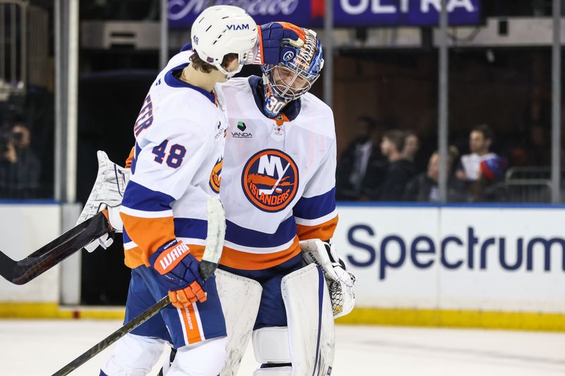 Nov 8, 2025; New York, New York, USA;  New York Islanders goaltender Ilya Sorokin (30) celebrates with defenseman Matthew Schaefer (48) after defeating the New York Rangers 5-0 at Madison Square Garden. Mandatory Credit: Wendell Cruz-Imagn Images