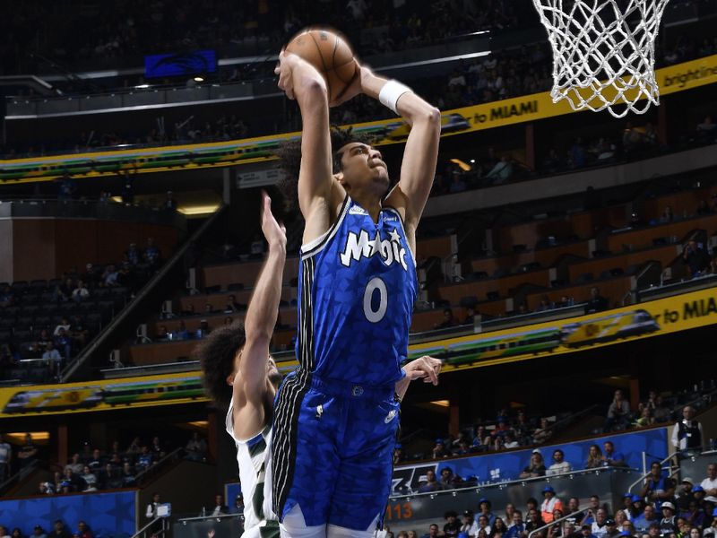 ORLANDO, FL - APRIL 14: Anthony Black #0 of the Orlando Magic dunks the ball during the game against the Milwaukee Bucks on April 14, 2024 at Kia Center in Orlando, Florida. NOTE TO USER: User expressly acknowledges and agrees that, by downloading and or using this photograph, User is consenting to the terms and conditions of the Getty Images License Agreement. Mandatory Copyright Notice: Copyright 2024 NBAE (Photo by Gary Bassing/NBAE via Getty Images)