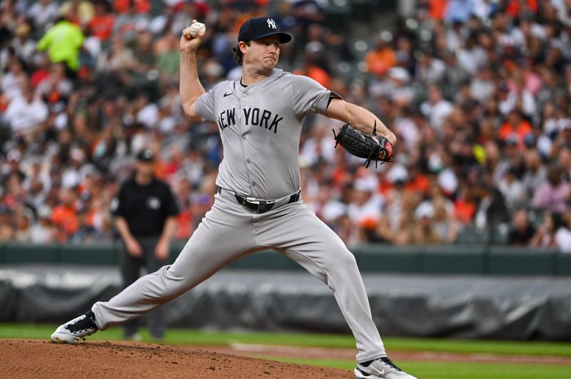 Jul 12, 2024; Baltimore, Maryland, USA; New York Yankees pitcher Gerrit Cole (45) throws a first inning pitch against the Baltimore Orioles  at Oriole Park at Camden Yards. Mandatory Credit: Tommy Gilligan-USA TODAY Sports