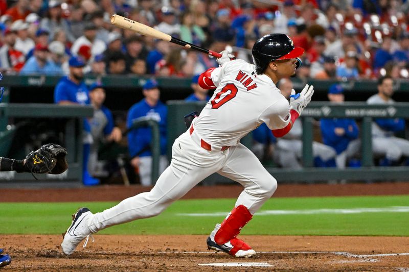 May 26, 2024; St. Louis, Missouri, USA;  St. Louis Cardinals shortstop Masyn Winn (0) hits a single against the Chicago Cubs during the fourth inning at Busch Stadium. Mandatory Credit: Jeff Curry-USA TODAY Sports