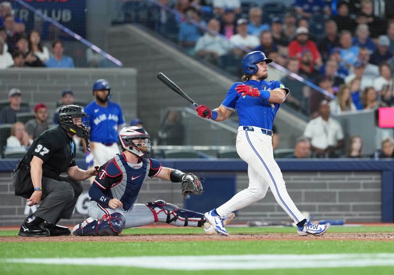 Aug 27, 2025; Toronto, Ontario, CAN; Toronto Blue Jays third baseman Addison Barger (47) hits a two run double against the Minnesota Twins during the eighth inning at Rogers Centre. Mandatory Credit: Nick Turchiaro-Imagn Images