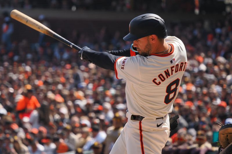 Apr 5, 2024; San Francisco, California, USA; San Francisco Giants left fielder Michael Conforto (8) hits an RBI double against the San Diego Padres during the first inning at Oracle Park. Mandatory Credit: Kelley L Cox-USA TODAY Sports