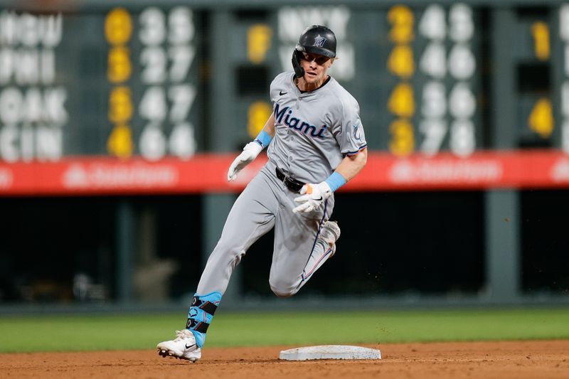 Aug 27, 2024; Denver, Colorado, USA; Miami Marlins center fielder Kyle Stowers (28) rounds second on a triple in the sixth inning against the Colorado Rockies at Coors Field. Mandatory Credit: Isaiah J. Downing-USA TODAY Sports