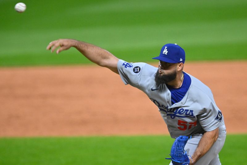 May 27, 2025; Cleveland, Ohio, USA; Los Angeles Dodgers relief pitcher Luis Garcia (57) delivers a pitch in the ninth inning against the Cleveland Guardians at Progressive Field. Mandatory Credit: David Richard-Imagn Images