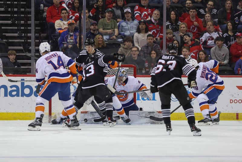 Apr 13, 2025; Newark, New Jersey, USA; New York Islanders goaltender Ilya Sorokin (30) makes a save against the New Jersey Devils during the first period at Prudential Center. Mandatory Credit: Ed Mulholland-Imagn Images