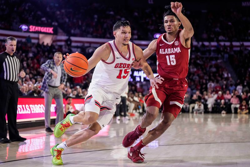 Jan 31, 2024; Athens, Georgia, USA; Georgia Bulldogs guard RJ Melendez (15) dribbles against Alabama Crimson Tide forward Jarin Stevenson (15) during the first half at Stegeman Coliseum. Mandatory Credit: Dale Zanine-USA TODAY Sports