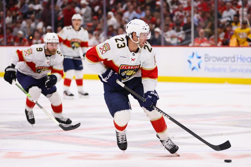 Mar 21, 2024; Sunrise, Florida, USA; Florida Panthers center Carter Verhaeghe (23) moves the puck against the Nashville Predators during the second period at Amerant Bank Arena. Mandatory Credit: Sam Navarro-USA TODAY Sports