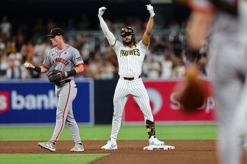 Sep 7, 2024; San Diego, California, USA; San Diego Padres pinch hitter Fernando Tatis Jr. (23) reacts after hitting a double against the San Francisco Giants during the ninth inning at Petco Park. Mandatory Credit: Chadd Cady-Imagn Images