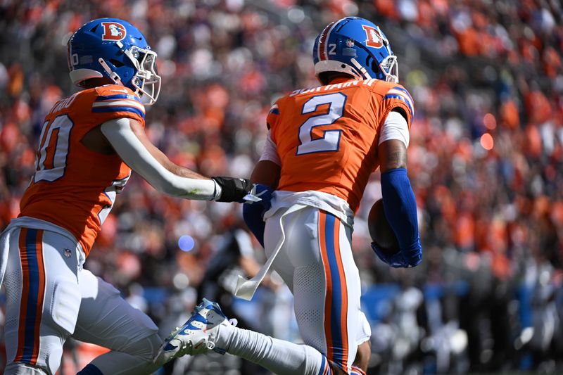 Denver Broncos cornerback Pat Surtain II (2) intercepts a pass and returns it for a 100-yard touchdown during the first half of an NFL football game against the Las Vegas Raiders, Sunday, Oct. 6, 2024, in Denver. (AP Photo/Geneva Heffernan)