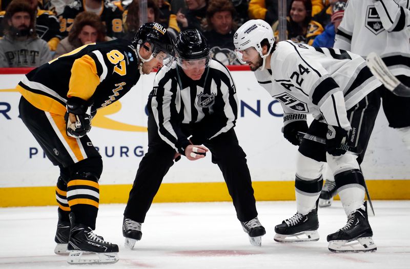 Feb 18, 2024; Pittsburgh, Pennsylvania, USA;  Pittsburgh Penguins center Sidney Crosby (87) and Los Angeles Kings center Phillip Danault (24) prepare to take a face-off during the third period at PPG Paints Arena. Los Angeles won 2-1. Mandatory Credit: Charles LeClaire-USA TODAY Sports