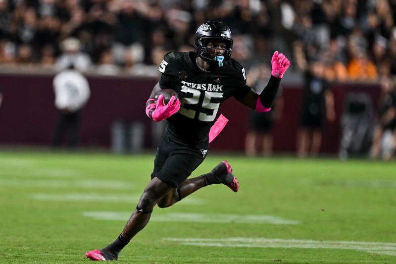 Oct 4, 2025; College Station, Texas, USA; Texas A&M Aggies defensive tackle DJ Hicks (5) runs the ball after a strip sack during the fourth quarter against the Mississippi State Bulldogs at Kyle Field. Mandatory Credit: Maria Lysaker-Imagn Images 
