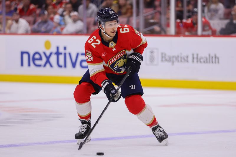 Apr 9, 2024; Sunrise, Florida, USA; Florida Panthers defenseman Brandon Montour (62) moves the puck against the Ottawa Senators during the first period at Amerant Bank Arena. Mandatory Credit: Sam Navarro-USA TODAY Sports