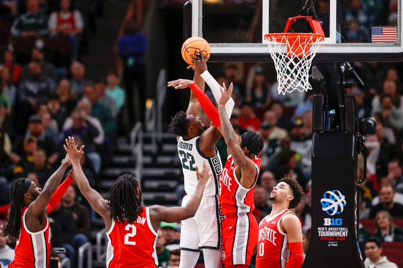 Mar 10, 2023; Chicago, IL, USA; Michigan State Spartans center Mady Sissoko (22) shoots against the Ohio State Buckeyes during the first half at United Center. Mandatory Credit: Kamil Krzaczynski-USA TODAY Sports