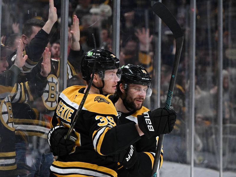 Jan 25, 2025; Boston, Massachusetts, USA; Boston Bruins center Morgan Geekie (39) celebrates with center Pavel Zacha (18) after scoring a goal against the Colorado Avalanche during the third period at the TD Garden. Mandatory Credit: Brian Fluharty-Imagn Images