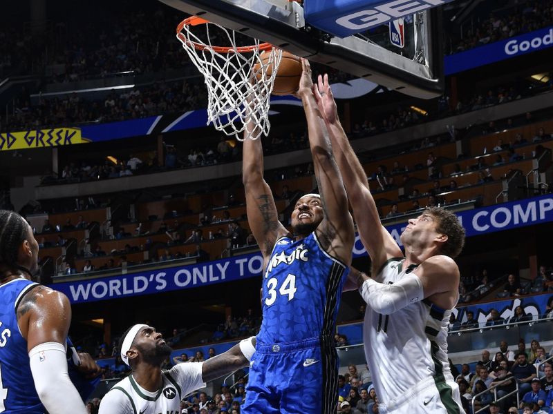 ORLANDO, FL - APRIL 14: Wendell Carter Jr. #34 of the Orlando Magic dunks the ball during the game against the Milwaukee Bucks on April 14, 2024 at Kia Center in Orlando, Florida. NOTE TO USER: User expressly acknowledges and agrees that, by downloading and or using this photograph, User is consenting to the terms and conditions of the Getty Images License Agreement. Mandatory Copyright Notice: Copyright 2024 NBAE (Photo by Gary Bassing/NBAE via Getty Images)