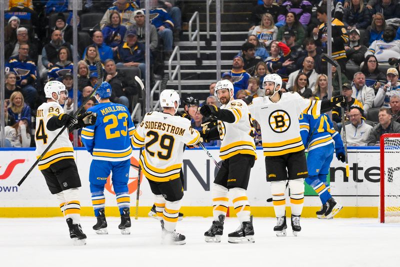 Dec 9, 2025; St. Louis, Missouri, USA; Boston Bruins center Sean Kuraly (52) is congratulated by teammates after scoring against the St. Louis Blues during the second period at Enterprise Center. Mandatory Credit: Jeff Curry-Imagn Images