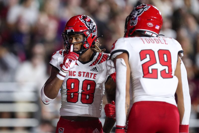 Oct 16, 2021; Chestnut Hill, Massachusetts, USA; North Carolina State Wolfpack receiver Devin Carter (88) reacts after catching the ball for a touchdown during the first half against the Boston College Eagles at Alumni Stadium. Mandatory Credit: Paul Rutherford-USA TODAY Sports