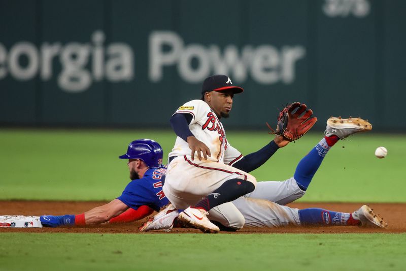 Sep 26, 2023; Atlanta, Georgia, USA; Chicago Cubs third baseman Miles Mastrobuoni (20) steals a base past Atlanta Braves second baseman Ozzie Albies (1) in the eighth inning at Truist Park. Mandatory Credit: Brett Davis-USA TODAY Sports