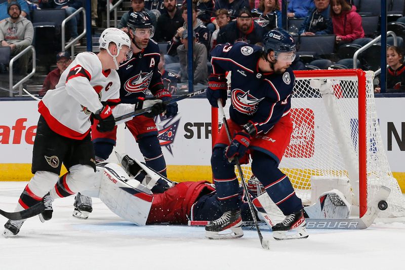 Mar 14, 2024; Columbus, Ohio, USA; Columbus Blue Jackets goalie Elvis Merzlikins (90) makes a stick save against the Ottawa Senators during overtime at Nationwide Arena. Mandatory Credit: Russell LaBounty-USA TODAY Sports