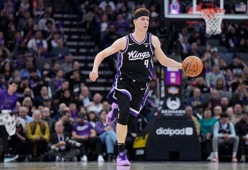 SACRAMENTO, CALIFORNIA - JANUARY 03: Kevin Huerter #9 of the Sacramento Kings dribbles the ball up court against the Orlando Magic during the first half of an NBA basketball game at Golden 1 Center on January 03, 2024 in Sacramento, California. NOTE TO USER: User expressly acknowledges and agrees that, by downloading and or using this photograph, User is consenting to the terms and conditions of the Getty Images License Agreement. (Photo by Thearon W. Henderson/Getty Images)