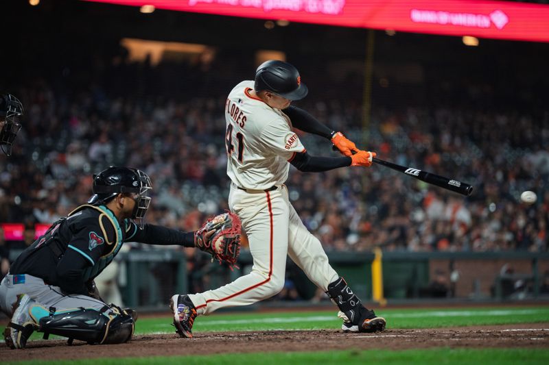 May 12, 2025; San Francisco, California, USA; San Francisco Giants first baseman Wilmer Flores (41) hits a single against the Arizona Diamondbacks during the seventh inning at Oracle Park. Mandatory Credit: Neville E. Guard-Imagn Images