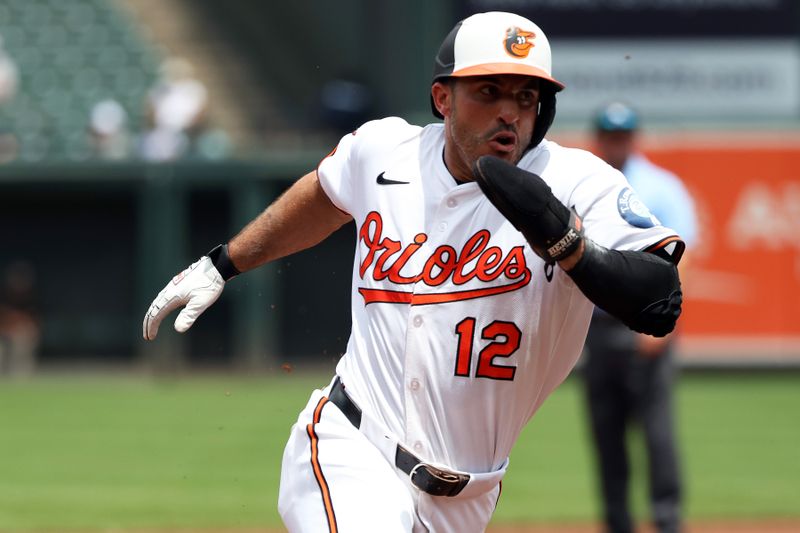 Jun 29, 2025; Baltimore, Maryland, USA; Baltimore Orioles outfielder Ramon Laureano (12) rounds third base to score a run during the second inning against the Tampa Bay Rays at Oriole Park at Camden Yards. Mandatory Credit: Daniel Kucin Jr.-Imagn Images