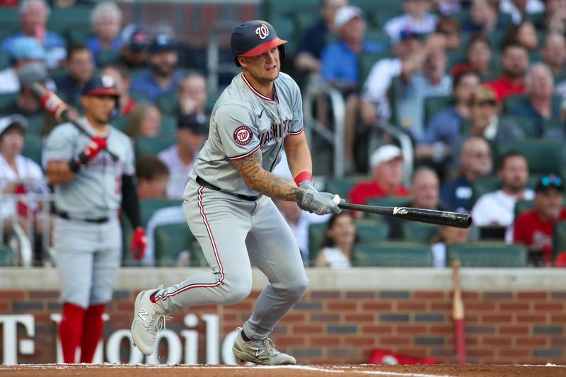 May 30, 2024; Atlanta, Georgia, USA; Washington Nationals third baseman Nick Senzel (13) hits a single against the Atlanta Braves in the second inning at Truist Park. Mandatory Credit: Brett Davis-USA TODAY Sports