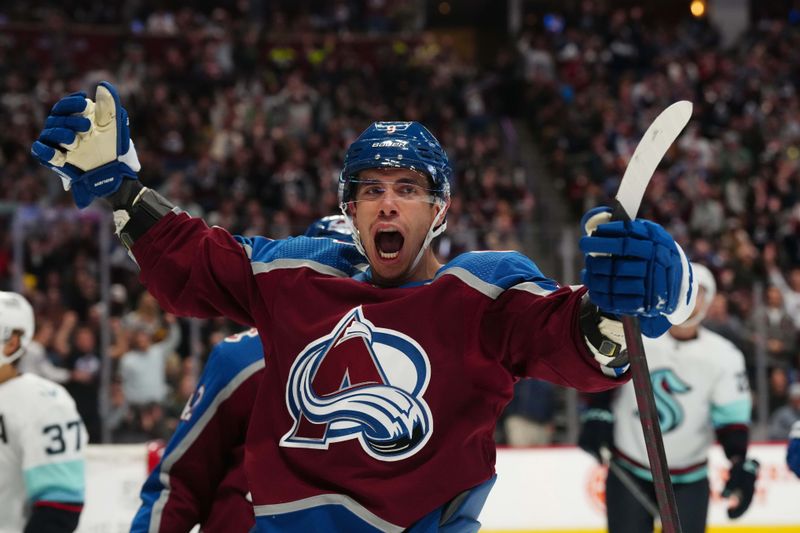 Oct 21, 2022; Denver, Colorado, USA; Colorado Avalanche center Evan Rodrigues (9) celebrates his goal in the second period against the Seattle Kraken at Ball Arena. Mandatory Credit: Ron Chenoy-USA TODAY Sports