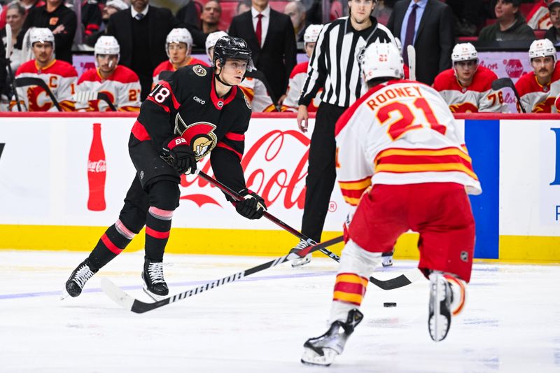 Nov 25, 2024; Ottawa, Ontario, CAN; Ottawa Senators center Tim Stutzle (18) plays the puck against Calgary Flames center Kevin Rooney (21) during the third period at Canadian Tire Centre. Mandatory Credit: David Kirouac-Imagn Images