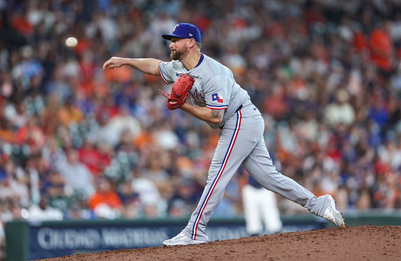 Jul 14, 2024; Houston, Texas, USA; Texas Rangers relief pitcher Kirby Yates (39) delivers a pitch during the ninth inning against the Houston Astros at Minute Maid Park. Mandatory Credit: Troy Taormina-USA TODAY Sports