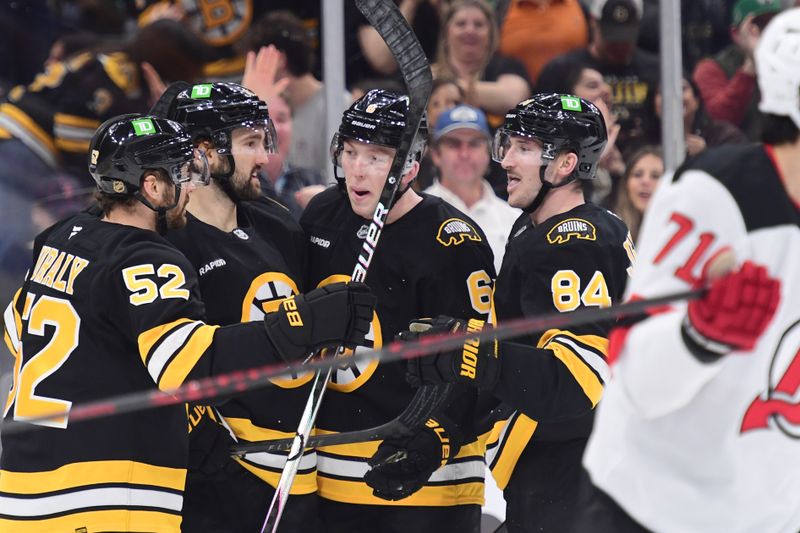 Apr 14, 2026; Boston, Massachusetts, USA; Boston Bruins center Mark Kastelic (47) celebrates after scoring his second goal with his teammates during the first period against the New Jersey Devils at TD Garden. Mandatory Credit: Bob DeChiara-Imagn Images