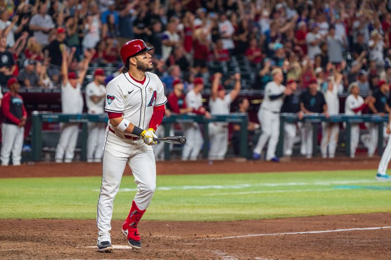 Sep 15, 2024; Phoenix, Arizona, USA; Arizona Diamondbacks infielder Eugenio Suárez (28) reacts after hitting a sharp fly ball to right field to score the winning runs in the tenth inning against the Milwaukee Brewers at Chase Field. Mandatory Credit: Allan Henry-Imagn Images