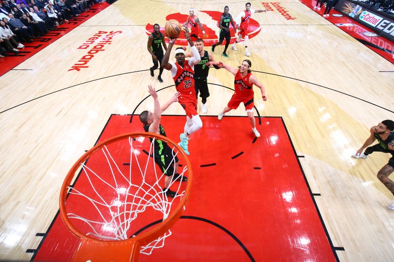 TORONTO, CANADA - JANUARY 15: Chris Boucher #25 of the Toronto Raptors shoots the ball during the game against the Boston Celtics on January 15, 2025 at the Scotiabank Arena in Toronto, Ontario, Canada.  NOTE TO USER: User expressly acknowledges and agrees that, by downloading and or using this Photograph, user is consenting to the terms and conditions of the Getty Images License Agreement.  Mandatory Copyright Notice: Copyright 2025 NBAE (Photo by Vaughn Ridley/NBAE via Getty Images)