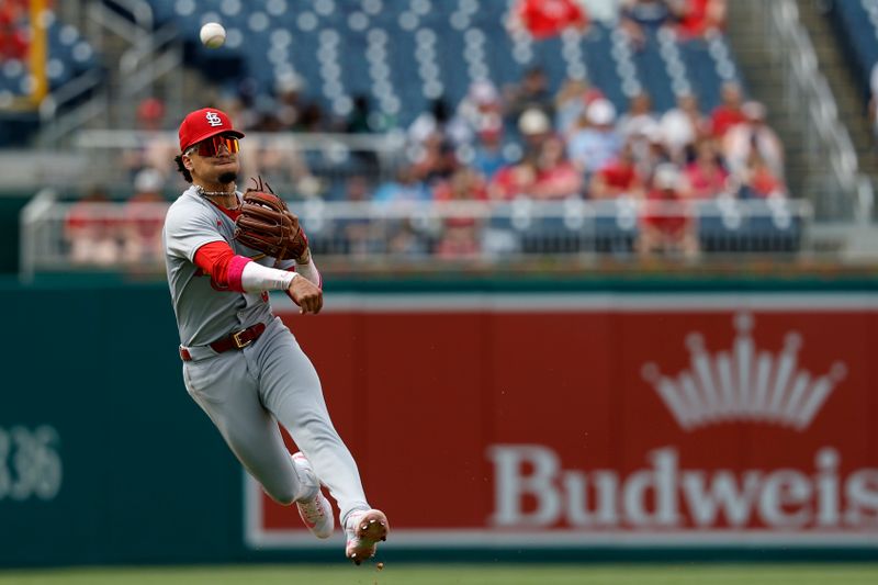 May 11, 2025; Washington, District of Columbia, USA; St. Louis Cardinals shortstop Masyn Winn (0) makes a throw to first base on a ground ball by Washington Nationals outfielder Dylan Crews (not pictured) during the seventh inning at Nationals Park. Mandatory Credit: Geoff Burke-Imagn Images