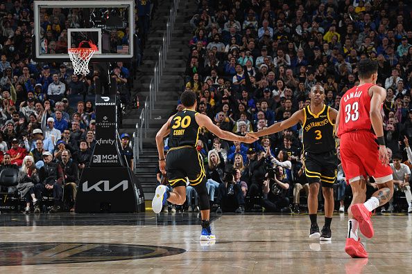 SAN FRANCISCO, CA - DECEMBER 23: Stephen Curry #30 and Chris Paul #3 of the Golden State Warriors high five during the game against the Portland Trail Blazers on December 23, 2023 at Chase Center in San Francisco, California. NOTE TO USER: User expressly acknowledges and agrees that, by downloading and or using this photograph, user is consenting to the terms and conditions of Getty Images License Agreement. Mandatory Copyright Notice: Copyright 2023 NBAE (Photo by Noah Graham/NBAE via Getty Images)